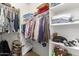 Walk-in closet with shelving and hanging space for organized storage at 22552 E Via Estancia --, Queen Creek, AZ 85142