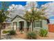 Inviting single-story home with desert landscaping, offering a warm and welcoming curb appeal on a partly cloudy day at 22552 E Via Estancia --, Queen Creek, AZ 85142