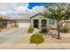 Lovely single-story home with a well-manicured lawn and inviting curb appeal, perfect for a cozy living environment at 22552 E Via Estancia --, Queen Creek, AZ 85142