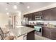 Kitchen view showcasing granite countertops, stainless steel appliances, and a center island with seating at 22552 E Via Estancia --, Queen Creek, AZ 85142