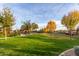 Lush park with green lawns, walking paths, and mature trees offering a serene outdoor space at 22552 E Via Estancia --, Queen Creek, AZ 85142