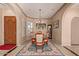 Elegant dining room featuring tile floors, neutral walls, and a stylish chandelier at 2325 W Mineral Rd, Phoenix, AZ 85041