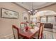 Elegant dining room with modern decor, stylish table and chairs at 2325 W Mineral Rd, Phoenix, AZ 85041