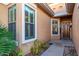 Inviting front entry with beautiful windows and an elegant wood door at 2325 W Mineral Rd, Phoenix, AZ 85041