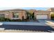Inviting home featuring a desert landscape, tile roof, and a convenient two-car garage at 2325 W Mineral Rd, Phoenix, AZ 85041