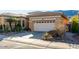 Charming home featuring a tile roof, two-car garage, and low-maintenance landscaping at 2325 W Mineral Rd, Phoenix, AZ 85041