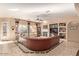 Bright and airy living room with tile floors, a fireplace, and comfortable seating at 2325 W Mineral Rd, Phoenix, AZ 85041