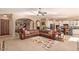 Open-concept living room featuring tile floors, archways, and plenty of seating at 2325 W Mineral Rd, Phoenix, AZ 85041