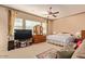 Serene main bedroom with neutral tones, plush carpeting, and ample natural light creates a relaxing retreat at 2325 W Mineral Rd, Phoenix, AZ 85041