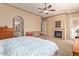 Well-appointed main bedroom featuring a fireplace, comfortable seating area, and an en-suite bathroom at 2325 W Mineral Rd, Phoenix, AZ 85041