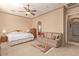 Spacious main bedroom with neutral colors, a cozy seating area, and an en-suite bathroom at 2325 W Mineral Rd, Phoenix, AZ 85041