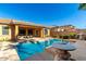 Outdoor pool with nearby residential building, privacy wall, and patio area for entertaining at 2325 W Mineral Rd, Phoenix, AZ 85041