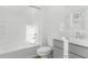 Bright bathroom featuring a shower and tub combo, and a modern vanity with sink and grey cabinets at 2825 W Eagle Talon Rd, Phoenix, AZ 85085