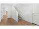 Bright entryway with hardwood floors and carpeted stairs leading upstairs at 2825 W Eagle Talon Rd, Phoenix, AZ 85085