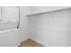 Cozy laundry room with a stackable washer/dryer and convenient shelving, offering efficiency and organization at 2825 W Eagle Talon Rd, Phoenix, AZ 85085