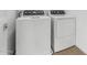 A crisp, clean laundry room features a white washer and dryer set at 2825 W Eagle Talon Rd, Phoenix, AZ 85085