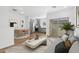 Open-concept living area with modern decor, a sliding glass door, and seamless transition to dining and kitchen at 2825 W Eagle Talon Rd, Phoenix, AZ 85085