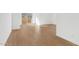 Bright living space with wood-look floors and sliding door to small patio at 2825 W Eagle Talon Rd, Phoenix, AZ 85085
