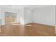 Bright living space featuring wood-look floors, sliding door to a patio, and white walls at 2825 W Eagle Talon Rd, Phoenix, AZ 85085