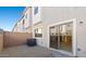 Low-maintenance backyard with gravel landscaping and sliding door access to living area at 2832 W Eagle Talon Rd, Phoenix, AZ 85085