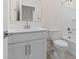 Bright bathroom featuring modern vanity, toilet and tub/shower combo in white, and tile flooring for a clean and functional space at 2832 W Eagle Talon Rd, Phoenix, AZ 85085