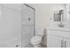 Bright bathroom features a glass-enclosed shower, and modern vanity provides a clean aesthetic at 2832 W Eagle Talon Rd, Phoenix, AZ 85085