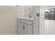 Bathroom featuring a vanity with white countertops and modern hardware, next to the entrance to the outdoor space at 2832 W Eagle Talon Rd, Phoenix, AZ 85085