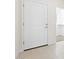 Bright entryway featuring a solid white door, modern hardware, and a glimpse into a well-organized closet space at 2832 W Eagle Talon Rd, Phoenix, AZ 85085