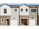 Charming townhome showcasing a blend of brick and modern siding, complemented by a convenient garage and inviting entry at 2832 W Eagle Talon Rd, Phoenix, AZ 85085