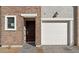 Welcoming brick facade featuring a private entrance, garage, and manicured walkway for easy access and curb appeal at 2832 W Eagle Talon Rd, Phoenix, AZ 85085