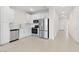 Contemporary kitchen boasting stainless steel appliances, white cabinetry, and a functional layout open to the living area at 2832 W Eagle Talon Rd, Phoenix, AZ 85085