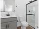 Modern bathroom featuring a glass-enclosed shower, and sleek gray vanity at 2835 W Eagle Talon Rd, Phoenix, AZ 85085