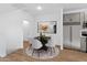 Bright dining area with modern furnishings complemented by stainless steel kitchen appliances and natural light at 2835 W Eagle Talon Rd, Phoenix, AZ 85085