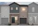 Modern townhome exterior features a mixed facade with brick and vertical siding details at 2835 W Eagle Talon Rd, Phoenix, AZ 85085