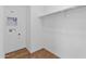 Empty walk-in closet features wood-look flooring, white walls, and a single rack at 2835 W Eagle Talon Rd, Phoenix, AZ 85085