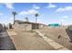 Wide view of fenced backyard with large shade structure and desert landscaping at 2921 W Luke Ave, Phoenix, AZ 85017