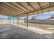 Backyard featuring a concrete patio area with a large covered structure and block wall at 2921 W Luke Ave, Phoenix, AZ 85017