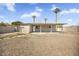 Expansive desert landscaped backyard with shade structure and block wall fencing at 2921 W Luke Ave, Phoenix, AZ 85017
