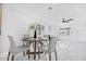 Cozy dining area with round table and four chairs, perfect for intimate meals and gatherings at 2921 W Luke Ave, Phoenix, AZ 85017