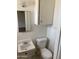 Clean half bathroom with a toilet and sink at 3347 E Palm Ln, Phoenix, AZ 85008