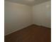 Well lit bedroom with hardwood floors and closet at 3347 E Palm Ln, Phoenix, AZ 85008