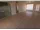 Bright living room featuring tile floors, an open layout, and easy access to the kitchen and outside at 3347 E Palm Ln, Phoenix, AZ 85008