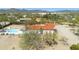 Aerial view highlighting a home with a pool, desert landscaping, and mountain views in a peaceful Arizona setting at 33810 N Smokehouse Trl, Cave Creek, AZ 85331