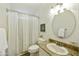 Bathroom featuring classic vanity, framed mirror, and tub with curtain at 33810 N Smokehouse Trl, Cave Creek, AZ 85331