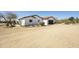 Beautiful home exterior with attached garage, terracotta roof and desert landscaping at 33810 N Smokehouse Trl, Cave Creek, AZ 85331