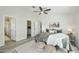 Calm main bedroom with ceiling fan, neutral decor, and ensuite access at 33810 N Smokehouse Trl, Cave Creek, AZ 85331
