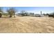 Wide view of large desert property showcasing home, fencing, and mature trees at 33810 N Smokehouse Trl, Cave Creek, AZ 85331