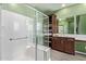 Bright bathroom with a glass-enclosed shower, vanity with storage, and modern finishes at 39758 N Hailey Ln, Queen Creek, AZ 85140