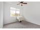 Minimalist bedroom with neutral color palette, ceiling fan, and window for natural light at 39758 N Hailey Ln, Queen Creek, AZ 85140