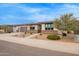 Charming single-story home with low-maintenance landscaping and a two-car garage at 39758 N Hailey Ln, Queen Creek, AZ 85140